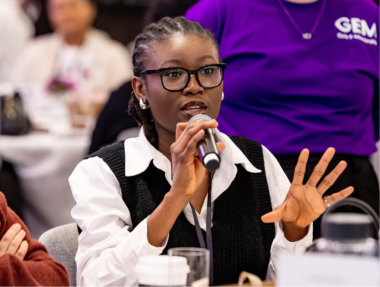A GEM mentee speaks at a Girls E-Mentorship event during an open discussion
